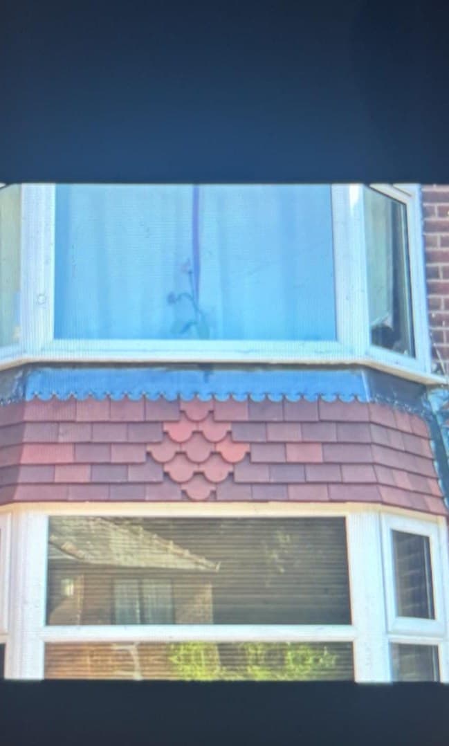 Decorative vertical roof tiles and lead details on domestic property Cooper Roofcraft