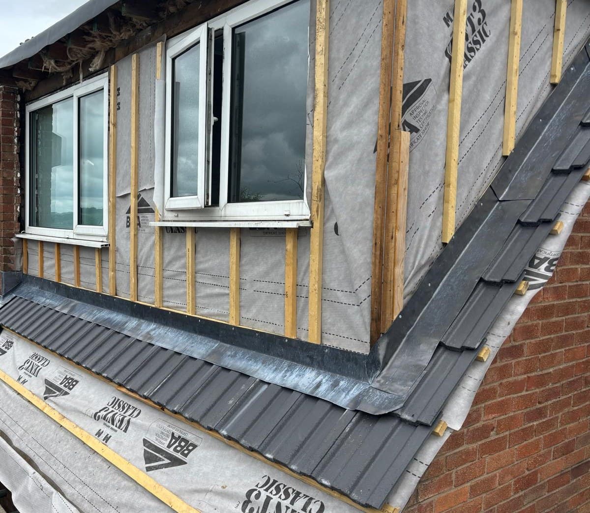 Dormer roof build-up with breathable membrane battens and lead flashing by roofer Bury Manchester