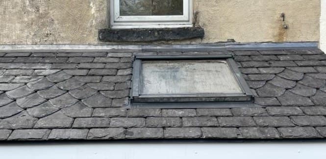 Scalloped slate roof detail and skylight specialist slating Cooper Roofcraft