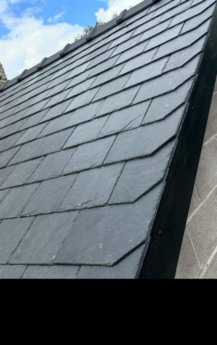 Natural slate roof installation blue sky domestic roofing Bury Manchester Cooper Roofcraft